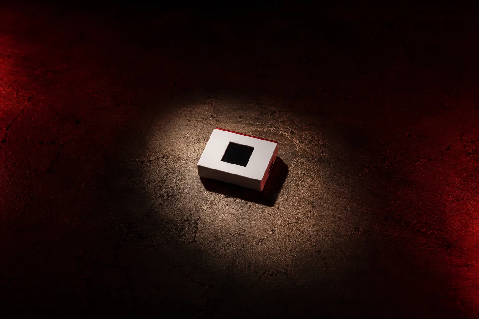 Nordvault device in spotlight on dark textured ground